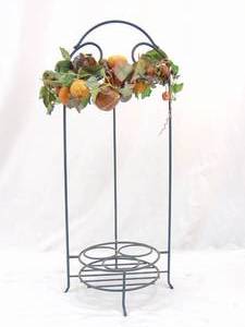 lot 234 image: Three Bottle Wine Rack with Fruit Decor