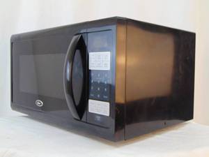 lot 921 image: OSTER Black Microwave Working