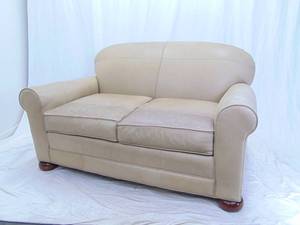 lot 17 image: Norwalk Furniture Light Beige Genuine Leather Loveseat