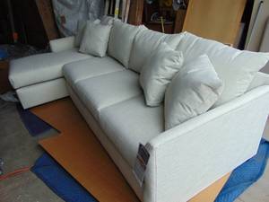lot 16 image: Klaussner Furniture Atlanta Sectional with Chaise Lounge - Beige Linen Tone Fabric