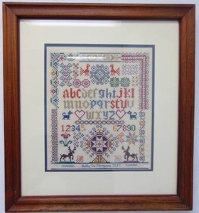 lot 124 image: Handmade Cross Stitch of the Alphabet with Celtic Designs in Walnut Frame with Glass 20 X 22
