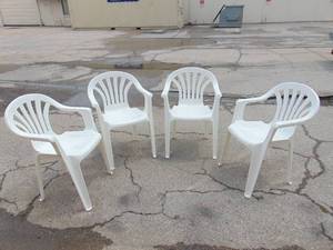 lot 528 image: Set of Four Stackable Plastic Patio Chairs