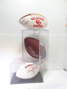 lot 2 image: Sam Bradford, Drake Stoops, and Barry Switzer Autographed Signed Oklahoma Sooners Logo Footballs