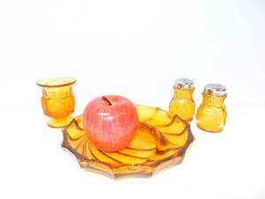 lot 144 image: Fostoria Amber Coin Glass Set- Ashtray, Salt and Pepper Shakers, toothpick Holder