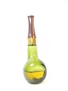 lot 131 image: Vintage Avon Pipe Half Full Green Gold Color Pipe Tai Winds After Shave