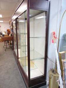 lot 75 image: Pair of Wood Trimmed Glass Lighted Display Shelves with Sliding Glass Doors