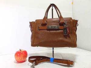 lot 218 image: NWT COACH Swagger 27 Carryall in Rainbow Stitch Leather F37695