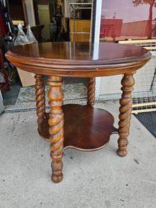lot 11 image: Stunning Round Solid Wood Turned Leg Table