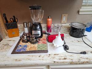lot 393 image: Large Kitchen Lot Hand Mixer, Crock Pot, Blender, Knife Block, Salt and Pepper Shakers, Placemats, and MORE