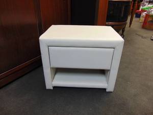 lot 566 image: Upholstered White Vinyl Nightstand
