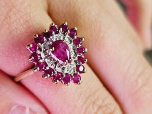lot 104 image: 10KT Yellow and White Gold Ruby and Diamond Ring SZ 7.25 Replacement Value $3,299.00Appraisal Certificate Included