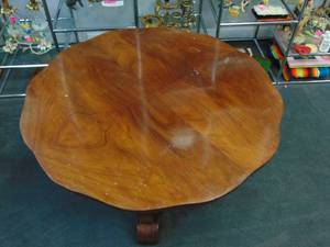 lot 147 image: Vintage Hardwood Round Coffee Table with Wavy Edges and a Walnut Finish