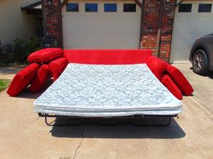 lot 532 image: Red Sofa with Pull out Bed by Posturpedic