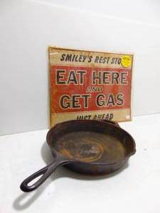 lot 392 image: LODGE USA Made #3 Cast Iron Skillet  Vintage FoodGas Tin Sign