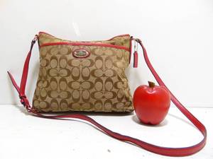 lot 110 image: Coach BeigeRed Signature Jacquard and Leather Swingpack Crossbody Bag