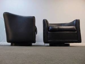 lot 10 image: PAIR of Black Vinyl Swivel Barrel Chairs by Cartwright
