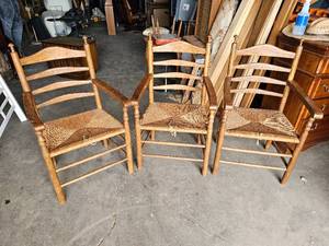 lot 175 image: Set of Three Wood and Wicker Ladder Back Arm Chairs