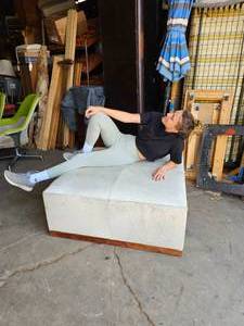 lot 213 image: Alder & Tweed Furniture Co. GEORGOUS Cowhide 40 Square Ottoman