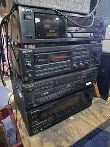 lot 143 image: Lot of Electronics with Bose Speakers, Sony Cassette Deck, Pioneer Stereo Receiver, Cables, and Remotes